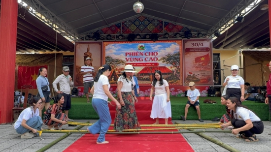 Visitors taking part in traditional bamboo dancing